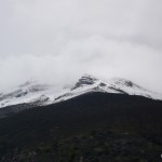 A glimpse of the volcano. Snow covered. And in clouds.
